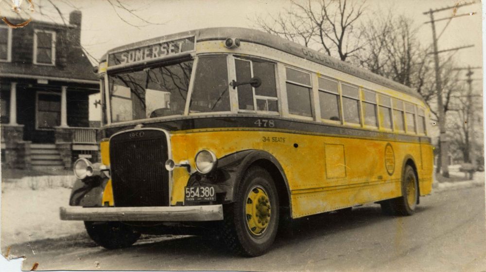 Antique orange bus 478 in service
